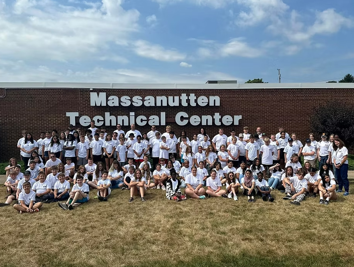 students in front of building